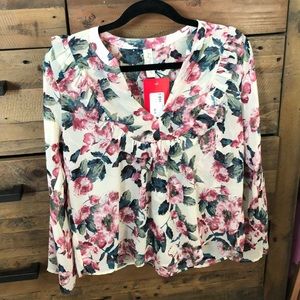 Floral blouse tag still on
